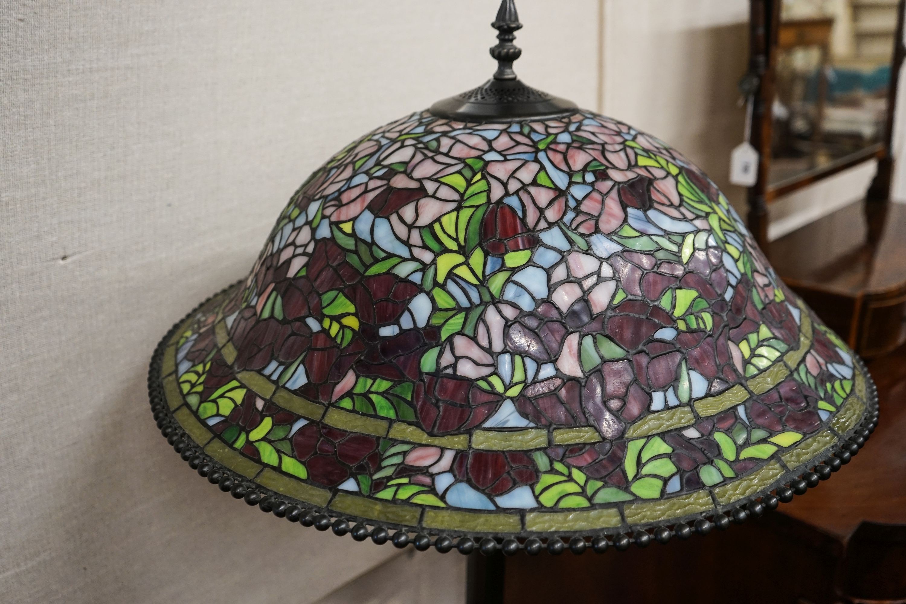 A bronzed finish Tiffany style standard lamp with shade, 160cm high, 59cm diameter
